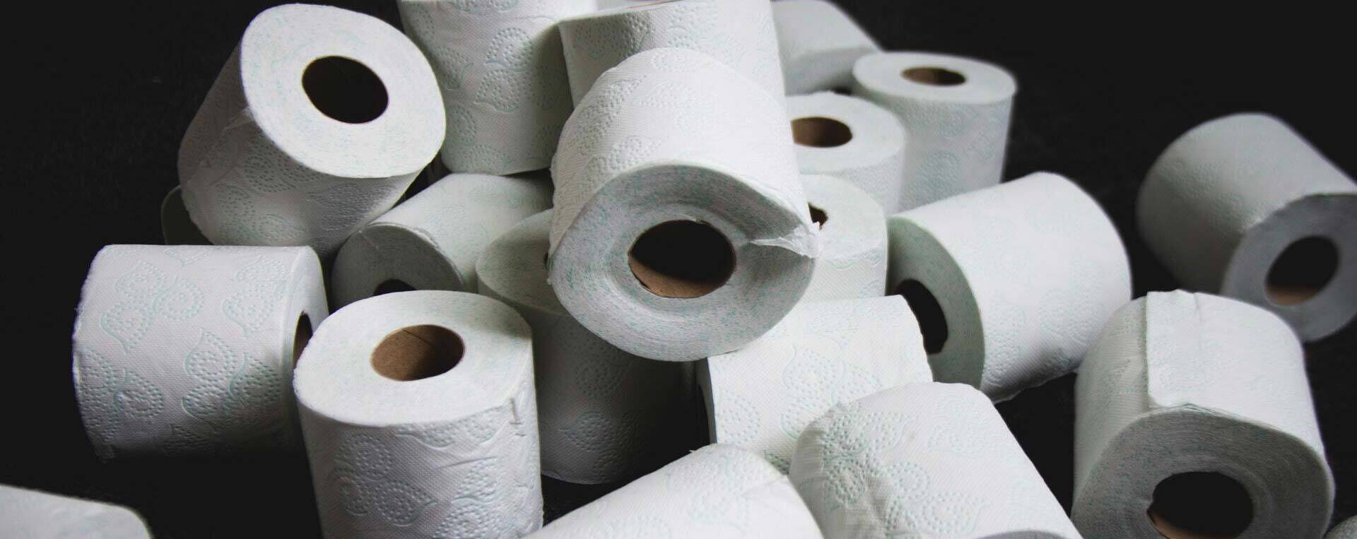 Toilet rolls on a black background